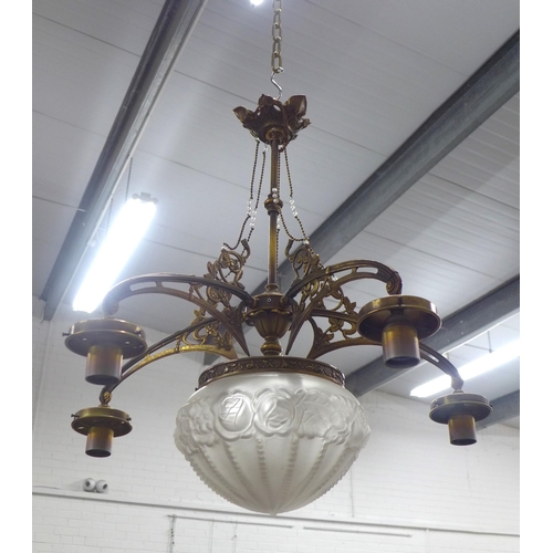 293 - Brass ceiling light with central moulded glass shade, , (A/F missing small shades). 66 x 66cm.