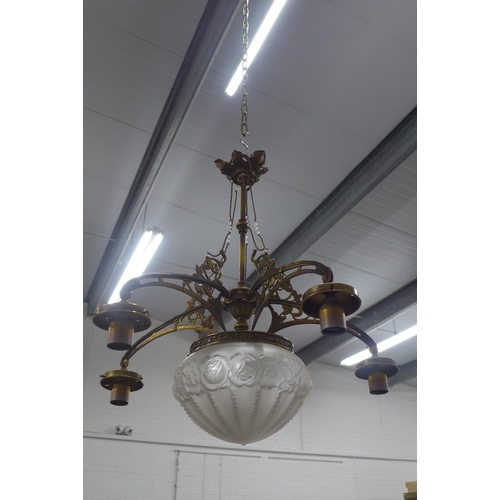 293 - Brass ceiling light with central moulded glass shade, , (A/F missing small shades). 66 x 66cm.