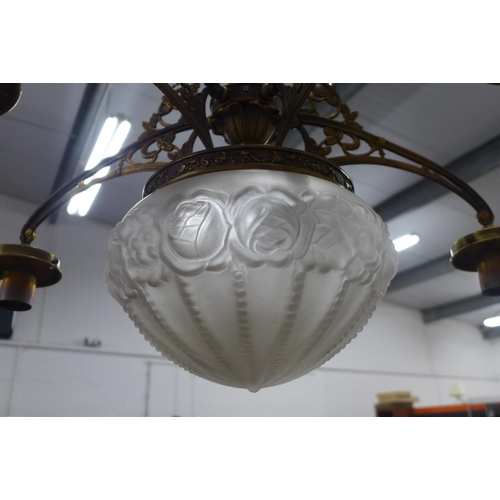 293 - Brass ceiling light with central moulded glass shade, , (A/F missing small shades). 66 x 66cm.