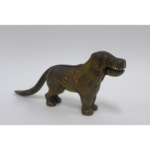 374 - An early 20th century novelty nut cracker in the form of a Dog22cm long