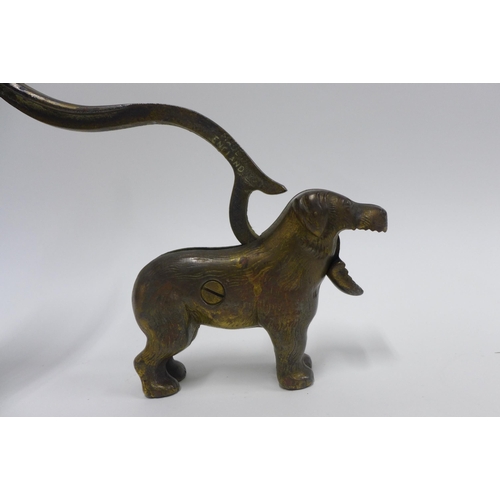 374 - An early 20th century novelty nut cracker in the form of a Dog22cm long