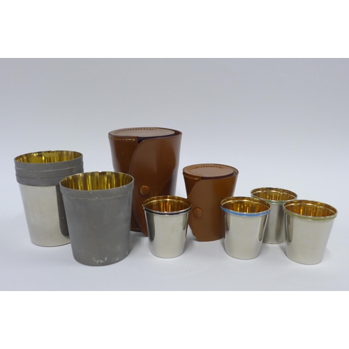 377 - Two sets of Epns and enamel beakers, in tan leather travelling cases