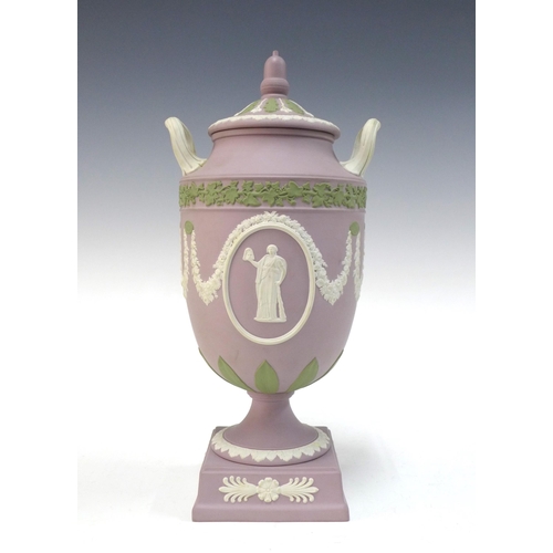 106 - Wedgwood lilac jasper ware two handled urn with cover, classical pattern with green leaf borders, im... 