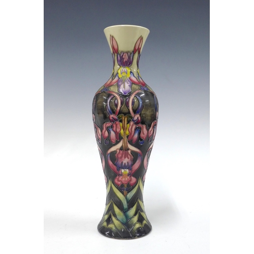 107 - Moorcroft pottery baluster vase, tubeline decorated with flowers and foliage, signed with initials M... 