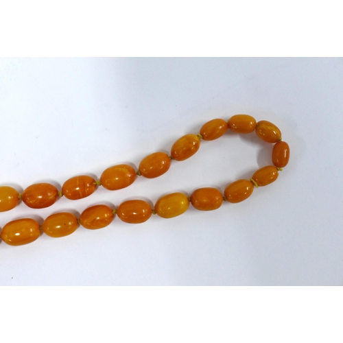 12 - Early 20th century graduating strand of faux butterscotch amber beads,