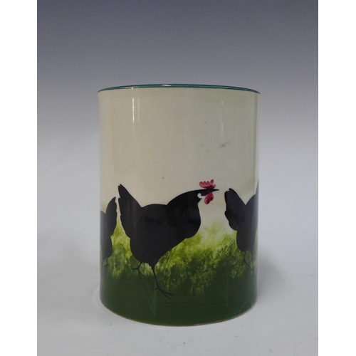 135 - Wemyss Ware, Robert Heron and Son, large black cockerel with hens mug, 14cm