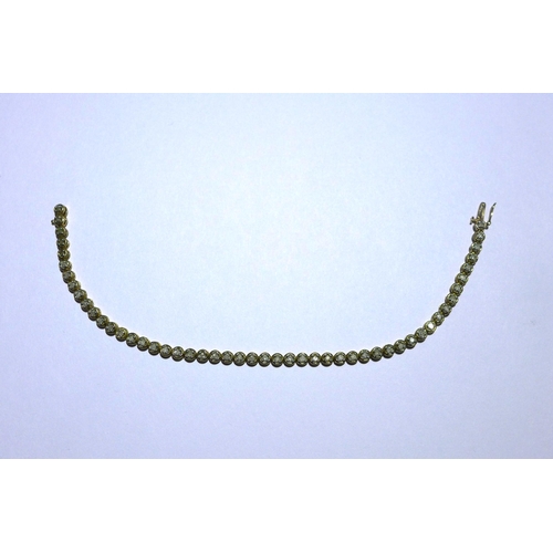 20 - 9ct gold gemset tennis bracelet, stamped 375