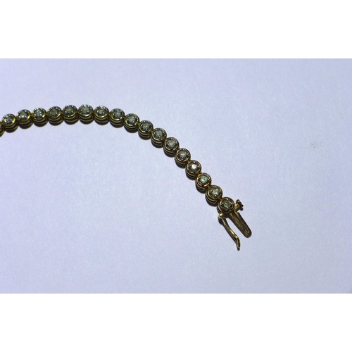 20 - 9ct gold gemset tennis bracelet, stamped 375