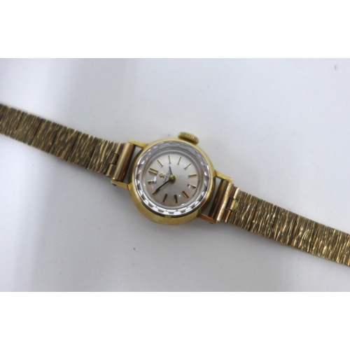 24 - Ladies vintage 9ct gold Omega wristwatch on a 9ct gold textured bracelet strap, Sheffield 1973