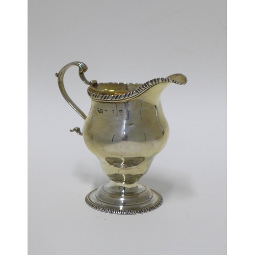 31 - A 19th century silver cream jug, London marks, 10cm