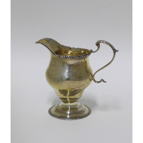 31 - A 19th century silver cream jug, London marks, 10cm