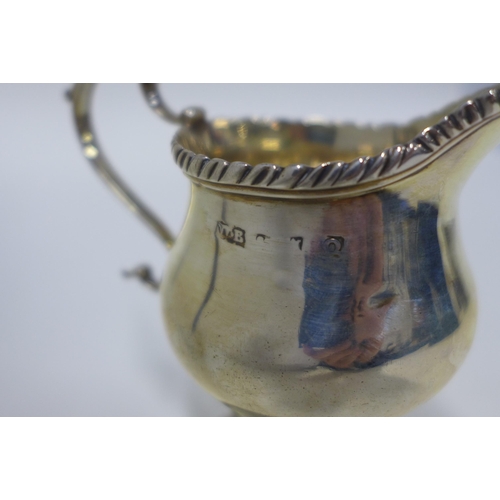 31 - A 19th century silver cream jug, London marks, 10cm