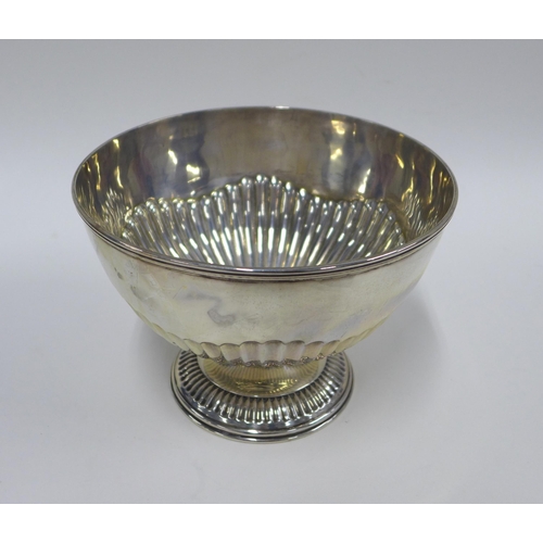 32 - An Edwardian silver bowl, half gadroon decoration and pedestal base, London 1903