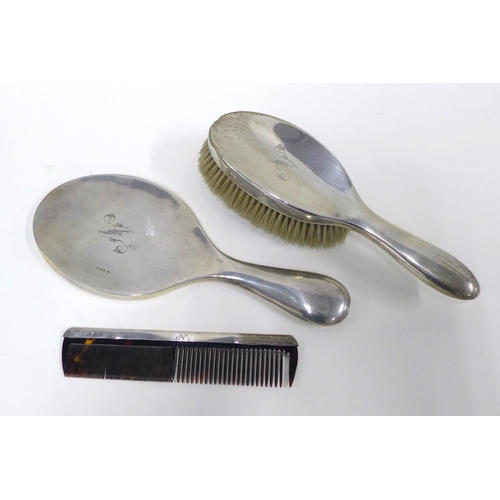 34 - Three piece silver backed dressing table brush set, (3)