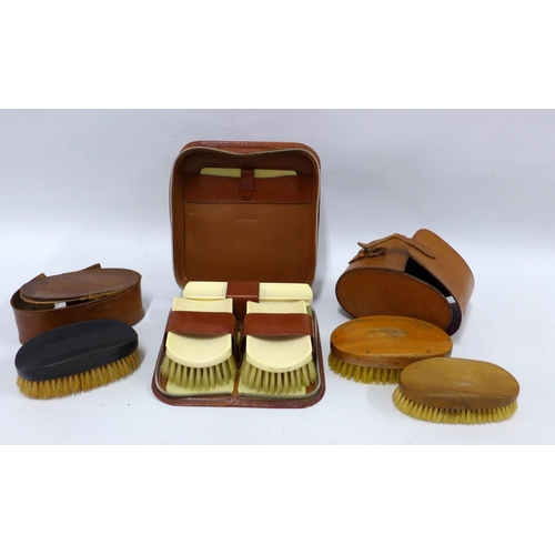 377 - Faux ivory cased brush set, together with an ebony brush in leather case and two other cased brushes... 