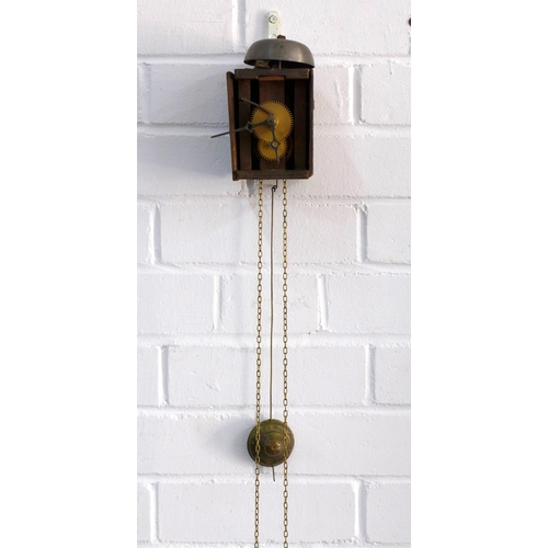 390 - Small wall mounted wooden clock, a/f with no face and one cherub pendulum, 9 x 15cm