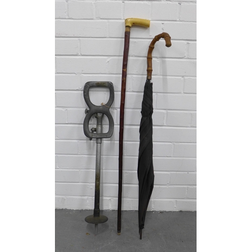 394 - Vintage bamboo handled umbrella, together with a walking stick and a metal shooting stick (3)