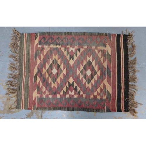 402 - Three bagface  cushions together with a small kilim rug, 98 x 68cm (4)