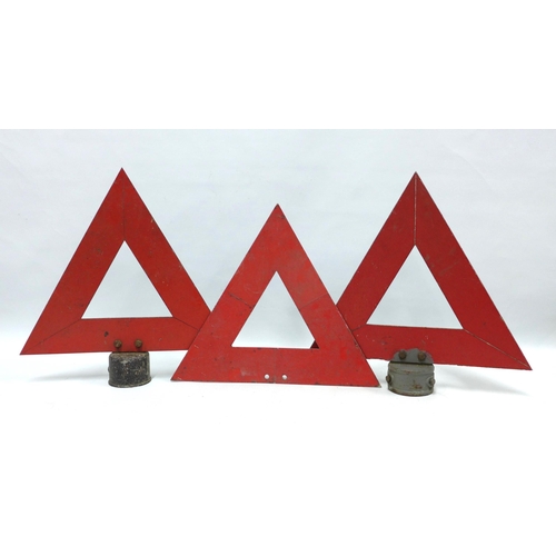 412 - Three vintage metal reflective red warning triangles, two on stands, 45cm (3)