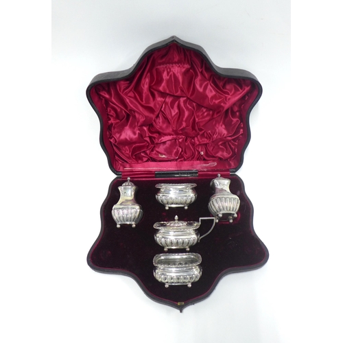 42 - Victorian five piece silver cruet set, Chester 1894, with half gadroon decoration, in fitted case (5... 