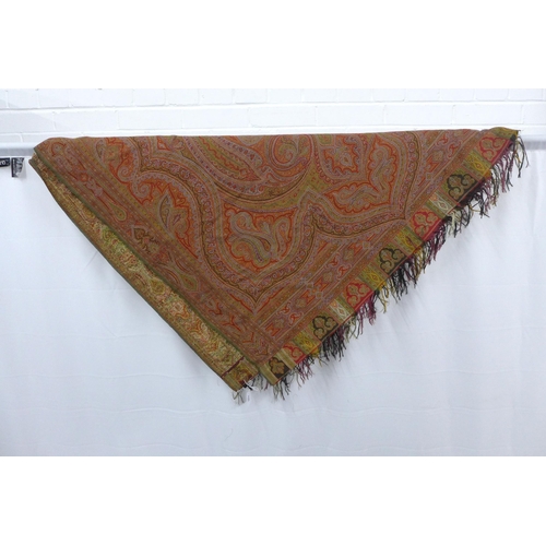 426 - A large Paisley shawl / tablecloth, finely woven in typical pattern and colours of red and green, 33... 