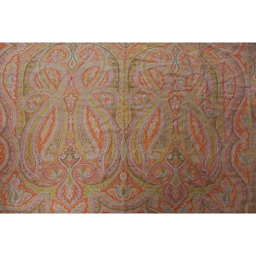 426 - A large Paisley shawl / tablecloth, finely woven in typical pattern and colours of red and green, 33... 