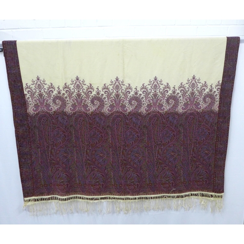 427 - A large Paisley shawl / tablecloth, cream in the centre with finely woven boteh border in claret, bo... 