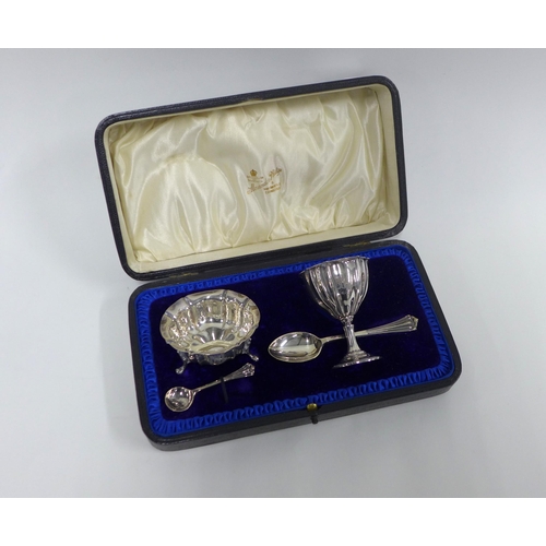 43 - Edwardian silver boxed set with egg cup, small bowl and two spoons, Sheffield 1905