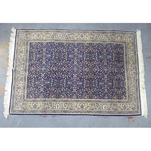 431 - Turkish, Kaysery Yun floral rug, blue foliate field and ivory border,  with certificate of guarantee... 