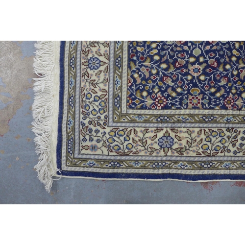 431 - Turkish, Kaysery Yun floral rug, blue foliate field and ivory border,  with certificate of guarantee... 