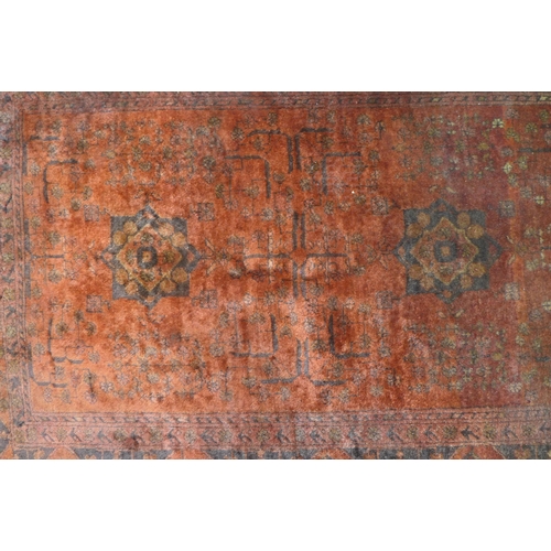 434 - Persian wool  rug with red field, 144 x 104cm.