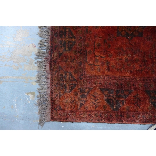 434 - Persian wool  rug with red field, 144 x 104cm.