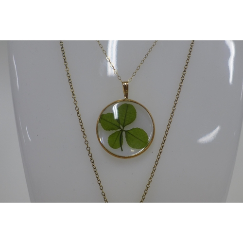 6 - Clover pendant on a 9ct gold trace link chain and a 9ct gold locket on chain