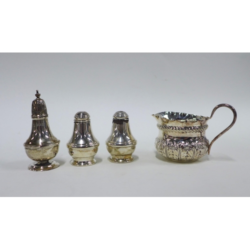 68 - Late Victorian silver cream jug, London 1900, a Birmingham silver three part cruet set and a silver ... 