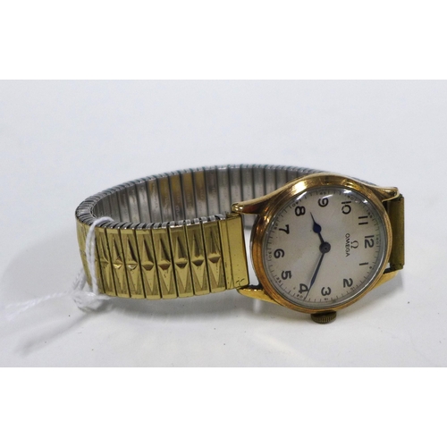 70 - OMEGA, a gents vintage gold cased wristwatch with silvered dial and Arabic numerals