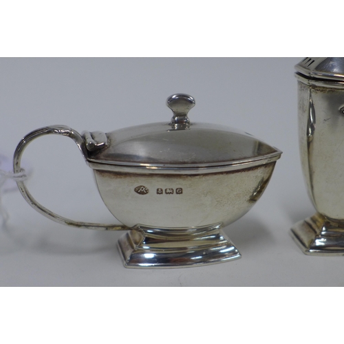 84 - George V silver three part condiment set, Birmingham 1931 (3)