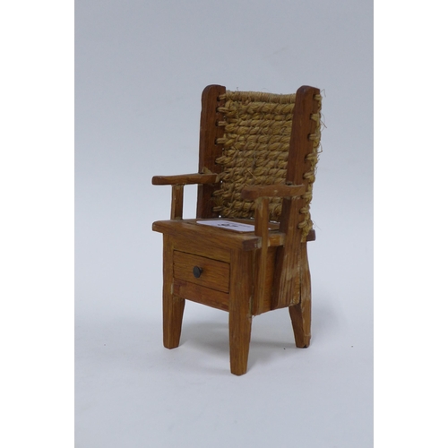 97 - Miniature Orkney chair of typical design with woven backrest and a drawer to the base, 13cm high