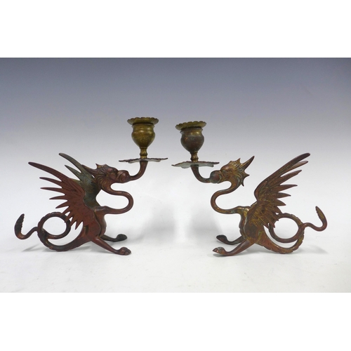 145 - Pair of griffin gilt metal candlesticks 27cm (2)