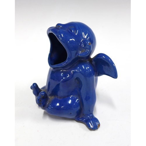 102 - C.H Brannam grotesque pottery spoon warmer, modelled as a winged imp, blue glazed with impressed mar... 