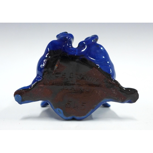 102 - C.H Brannam grotesque pottery spoon warmer, modelled as a winged imp, blue glazed with impressed mar... 