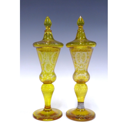 104 - Pair of amber bohemian glass goblet vases with covers, decorated with stags, 35cm (a/f) (2)