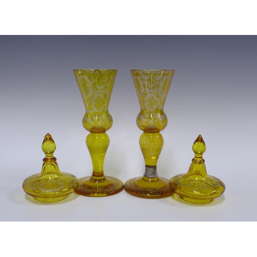 104 - Pair of amber bohemian glass goblet vases with covers, decorated with stags, 35cm (a/f) (2)