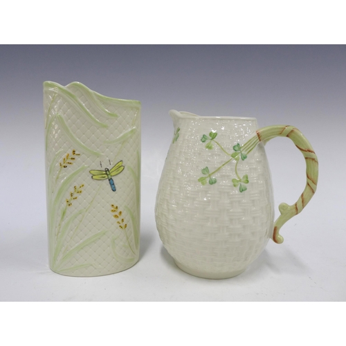 116 - Belleek jug, in a basketweave pattern with painted clovers, 16cm, together with a Belleek vase with ... 