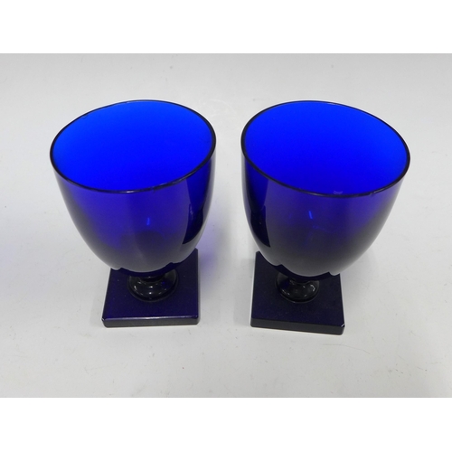 119 - Two Bristol blue wine glasses on square foot base, 13cm (2) (some rim chips)