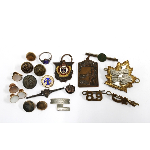 13 - Collection of early 20th century military cap badges and lapel pins, gold plated shirt studs, etc (a... 