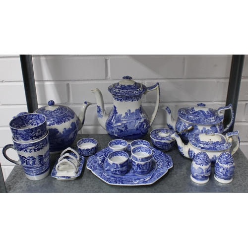 148 - Four shelves of Spode Italian blue and white tableware including jugs, tea and coffee pots, cups, eg... 