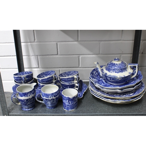 148 - Four shelves of Spode Italian blue and white tableware including jugs, tea and coffee pots, cups, eg... 