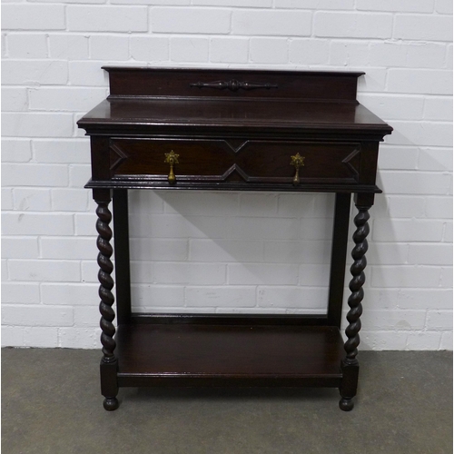 205 - An early 20th century oak ledgeback table with frieze drawer and raised on spiral stem legs,  75 x 9... 