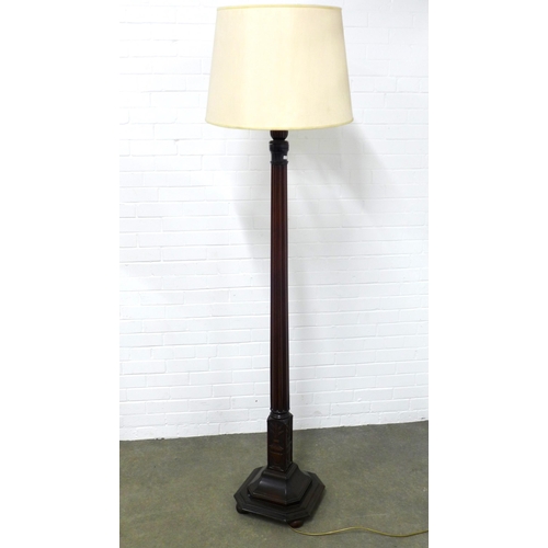 211 - Mahogany standard lamp, fluted stem and square canted  base, classical urn decoration,  170cm high.