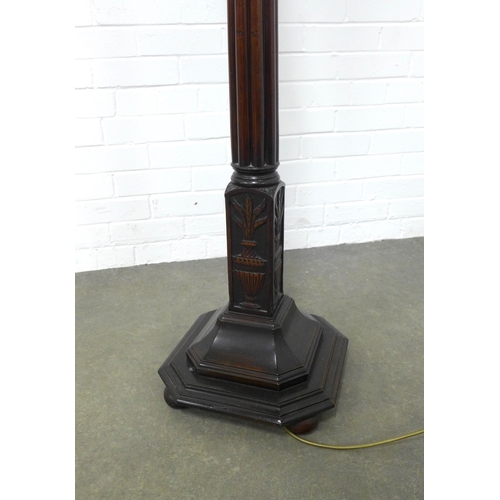 211 - Mahogany standard lamp, fluted stem and square canted  base, classical urn decoration,  170cm high.